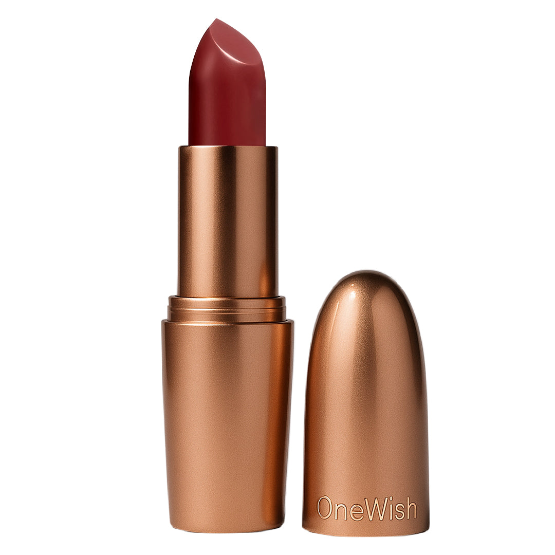 Lipstick with bronze casing and red lipstick on a white background, featuring the brand 'OneWish'.